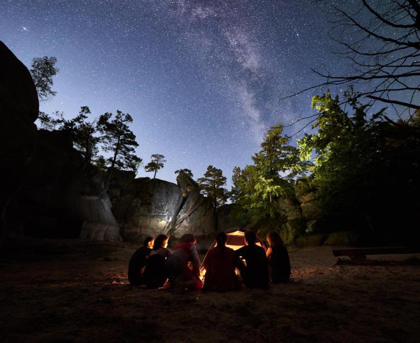Friends hikers resting beside camp campfire tent 2023 11 27 04 55 58 utc