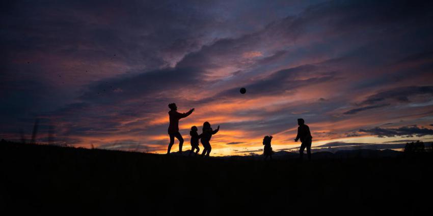 Silhouette of a young family of five playing with 2023 11 27 04 49 19 utc