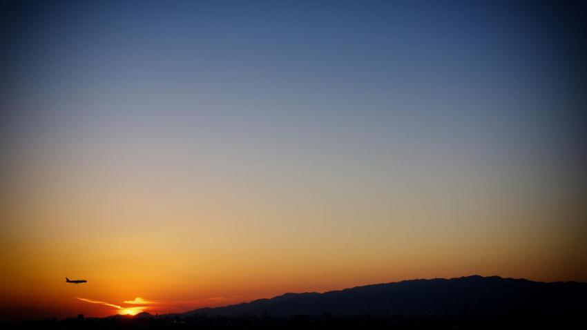 An airplane in the beautiful sunset