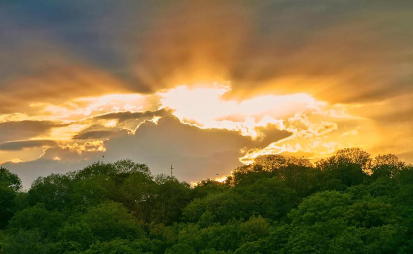 Sunset over the church in the park in the summer 2024 04 08 21 08 14 utc