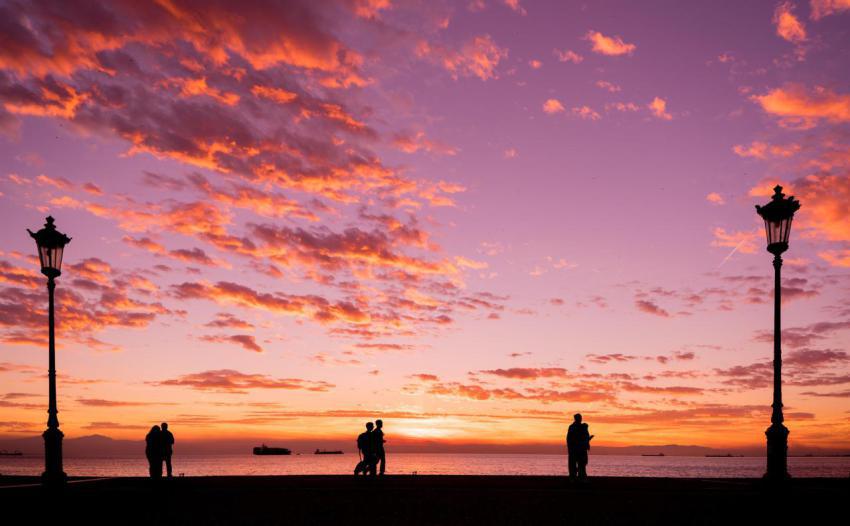 Silhouettes of people enjoying a walk during suns 2023 11 27 04 51 19 utc