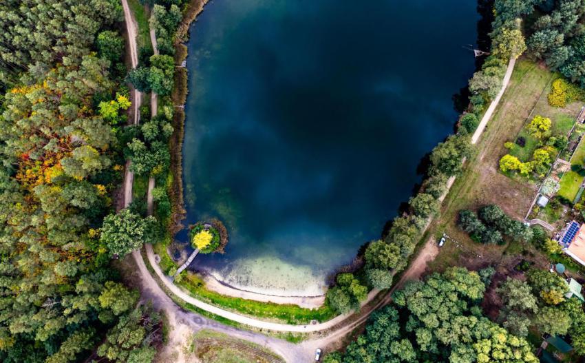 Aerial view of a narrow trail on the lakeside surr 2024 03 11 18 21 42 utc