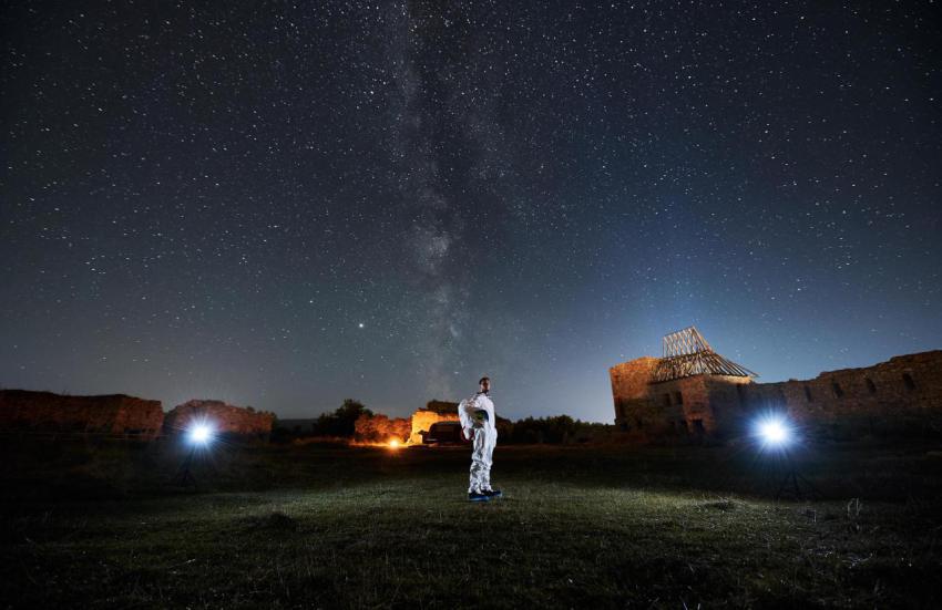 Space traveler standing and looking on starry sky 2023 11 27 05 12 48 utc