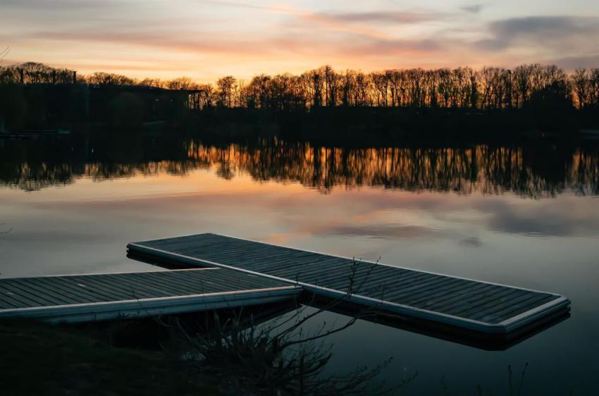 Tranquil dock situated on a still lake in the even 2023 11 27 05 15 13 utc