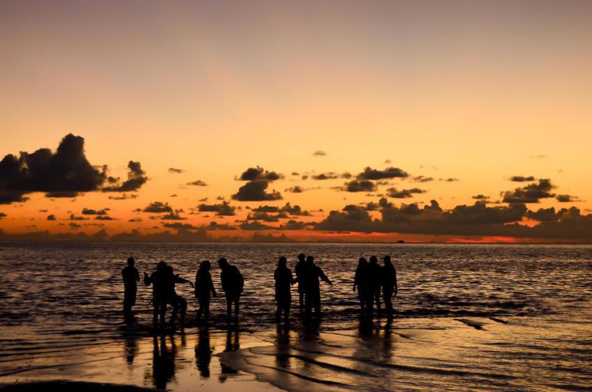 Silhouette of a group of young people on a beach a 2023 11 27 05 16 20 utc