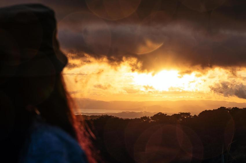 Woman watching the sunset in the countryside in co 2024 02 08 19 44 12 utc