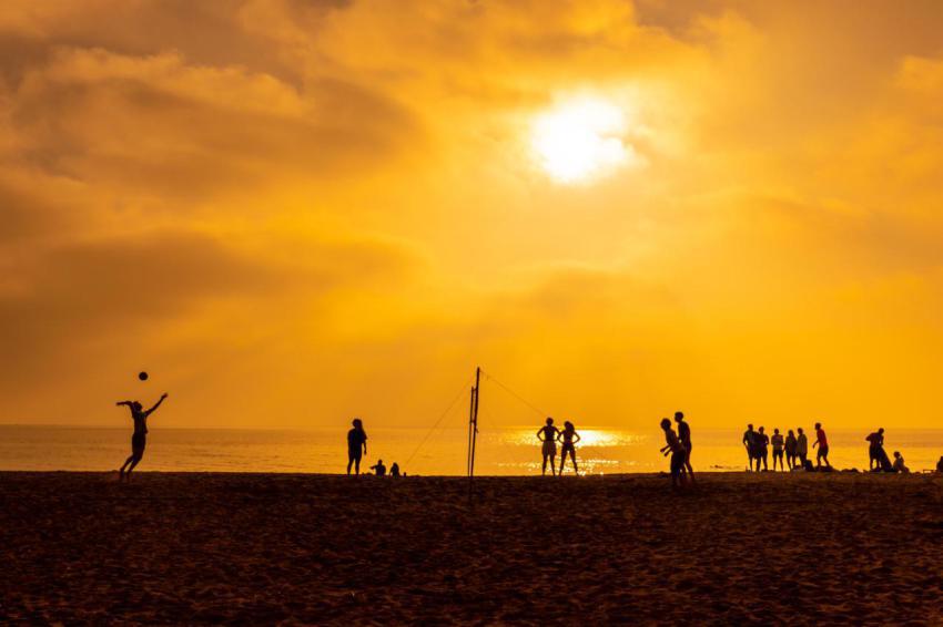 Some young people playing volleyball on the beach 2024 12 10 01 46 46 utc