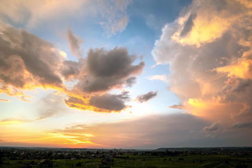 Dramatic sunset rural landscape with puffy clouds 2024 12 06 11 44 18 utc