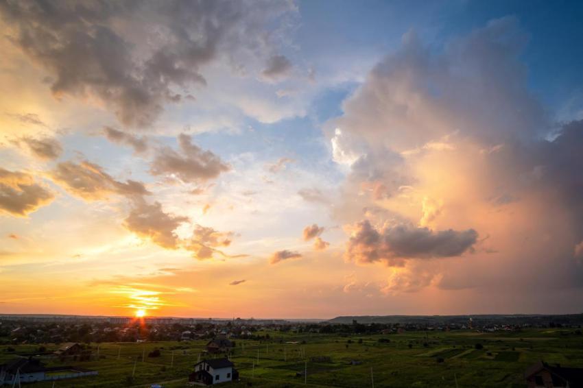 Dramatic sunset over rural area with stormy puffy 2024 12 06 02 45 15 utc