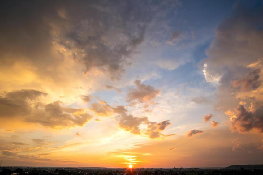 Dramatic sunset landscape with puffy clouds lit by 2024 12 06 20 12 47 utc