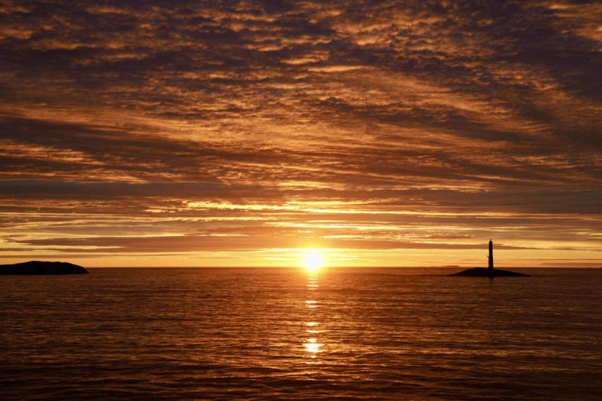Vibrant red sunset over ocean near vevang norway 2024 10 01 02 24 54 utc