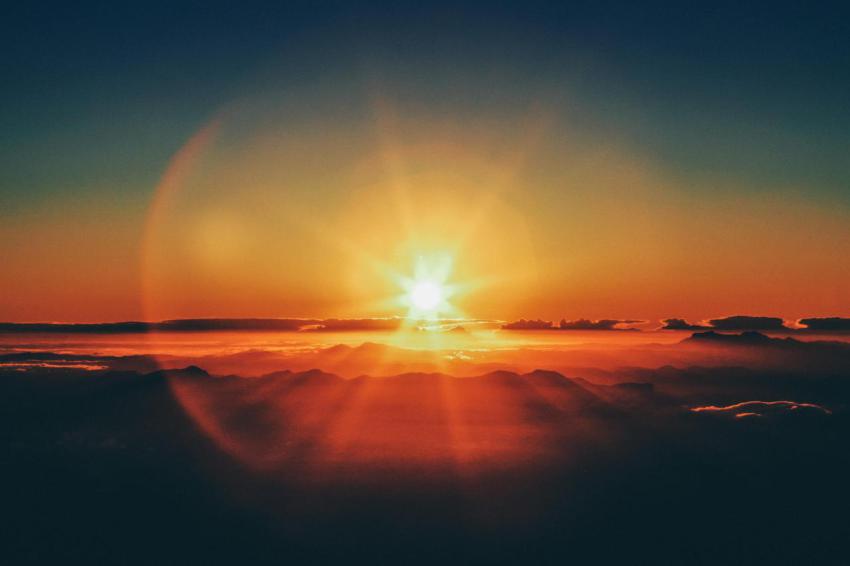 Horizontal shot of a sunset from a mountain cliff 2023 11 27 05 02 00 utc