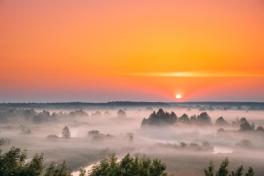 Amazing sunrise sunset over misty landscape sceni 2023 11 27 04 57 29 utc