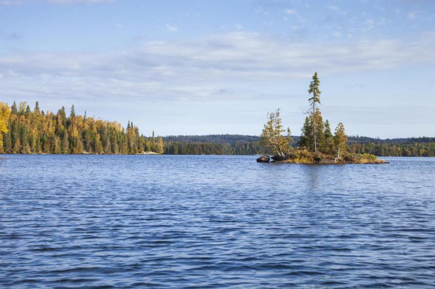 Blue boundary waters lake with a small island on a 2024 05 24 18 38 46 utc