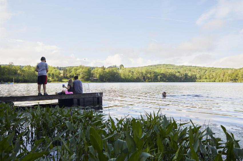 Three children on jetty father swimming in lake 2024 06 26 17 11 06 utc