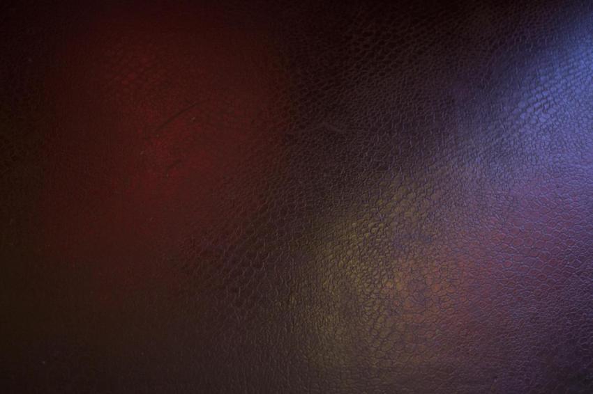 Black leather background with pink and green highl 2023 11 27 05 30 14 utc