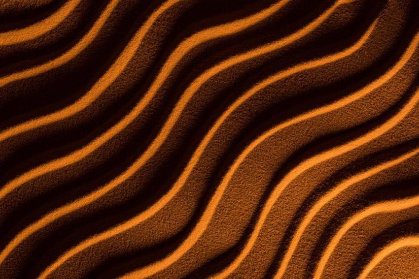 Top view of textured sand with waves and orange co 2024 11 14 14 40 49 utc