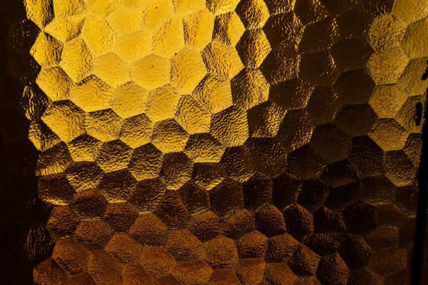 Abstract yellow coloured honeycomb shaped backlit 2023 11 27 05 26 30 utc