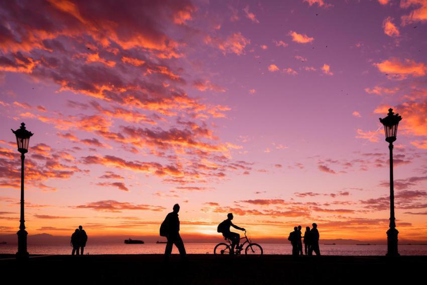 Silhouettes of people enjoying a walk during suns 2023 11 27 05 09 18 utc