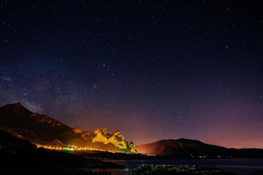 Starry sky over the city by the sea sicily italy 2023 11 27 05 13 59 utc