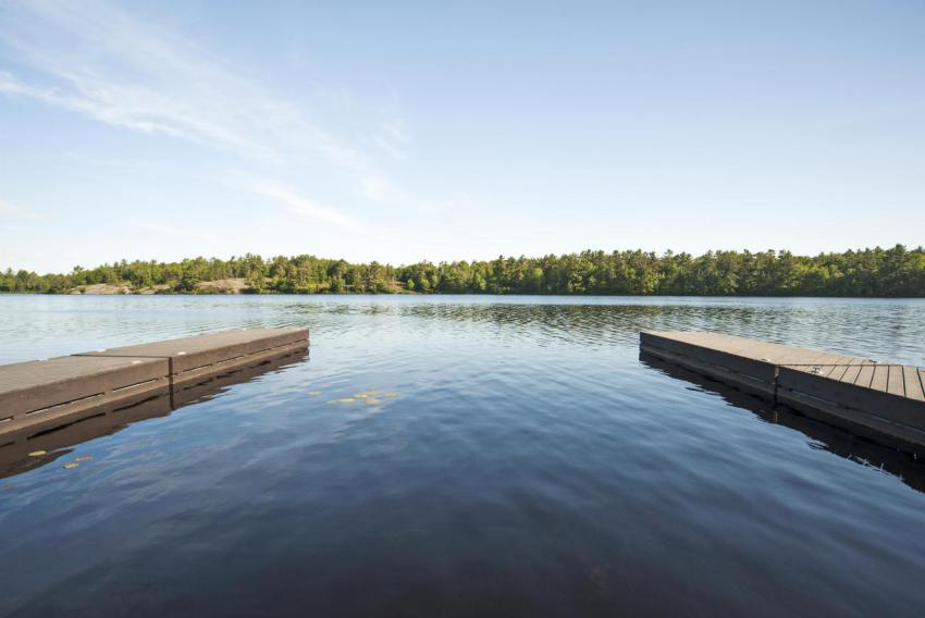 55084 wooden docks over still river in rural lands 2023 11 27 04 52 37 utc