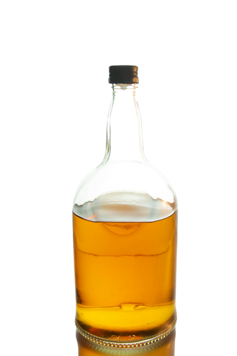 Bottle of amber colored whisky on the table with b 2023 11 27 05 20 24 utc