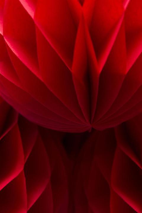 Detail of the red honeycomb paper balls decoration 2023 11 27 04 59 22 utc