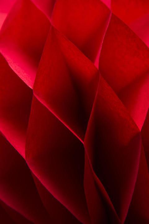 Detail of the red honeycomb paper ball decoration 2023 11 27 05 33 06 utc